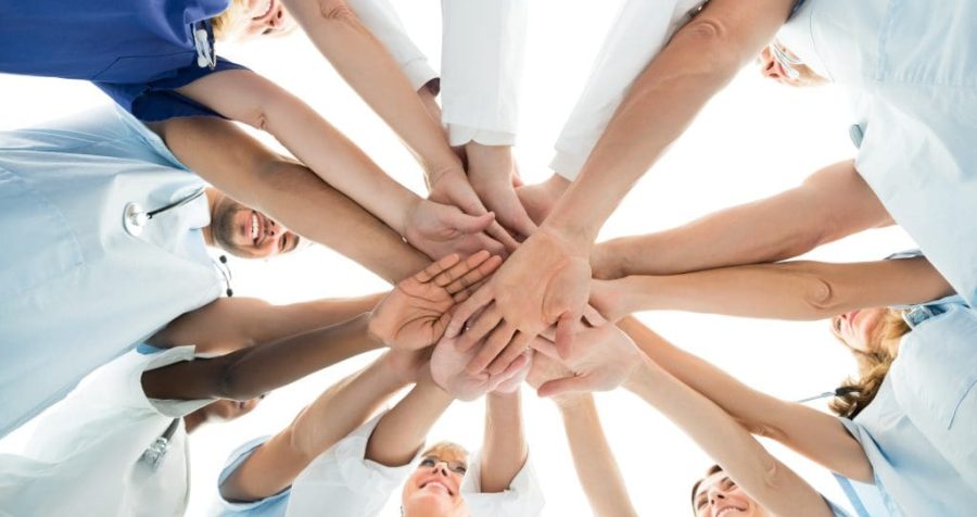 Multiethnic Medical Team Stacking Hands